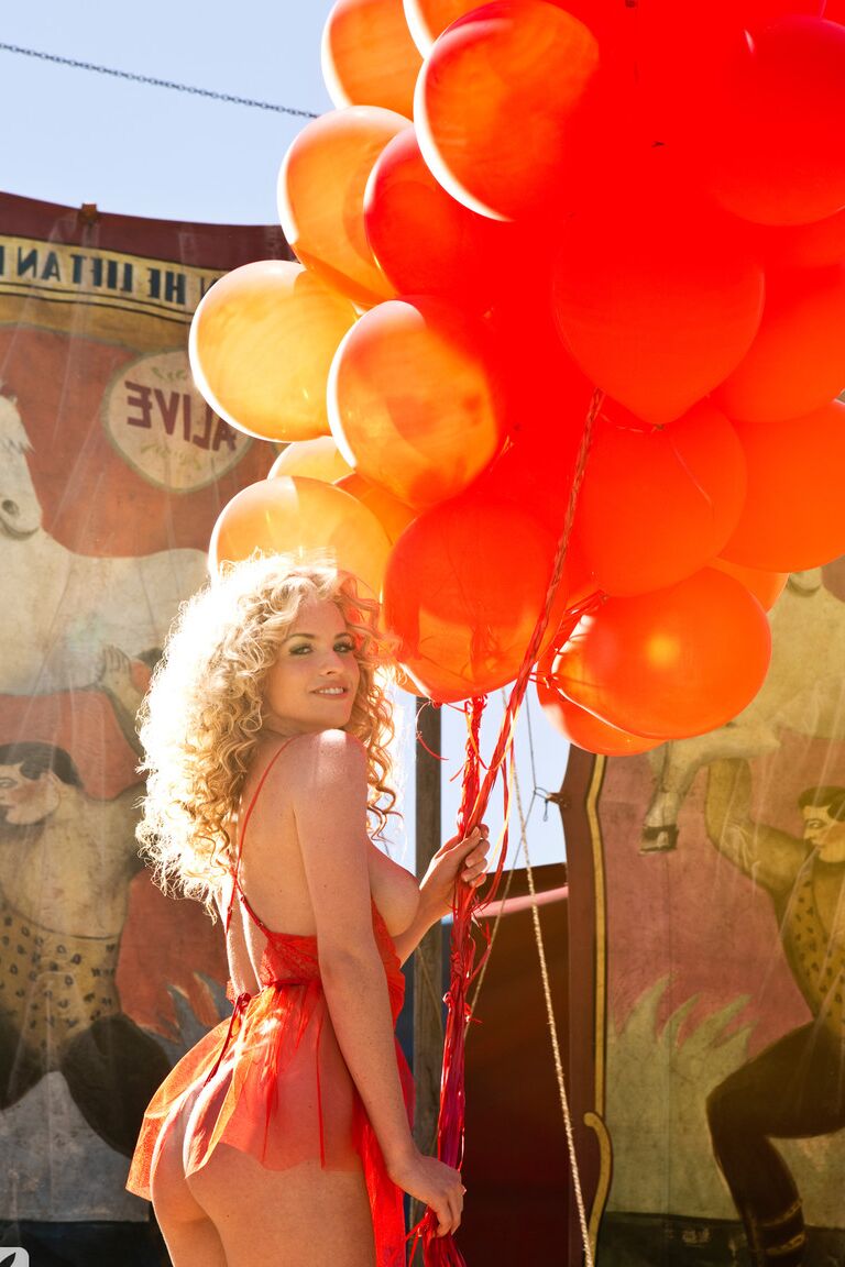 17P Busty circus presenter Carly Lauren strips while holding balloons