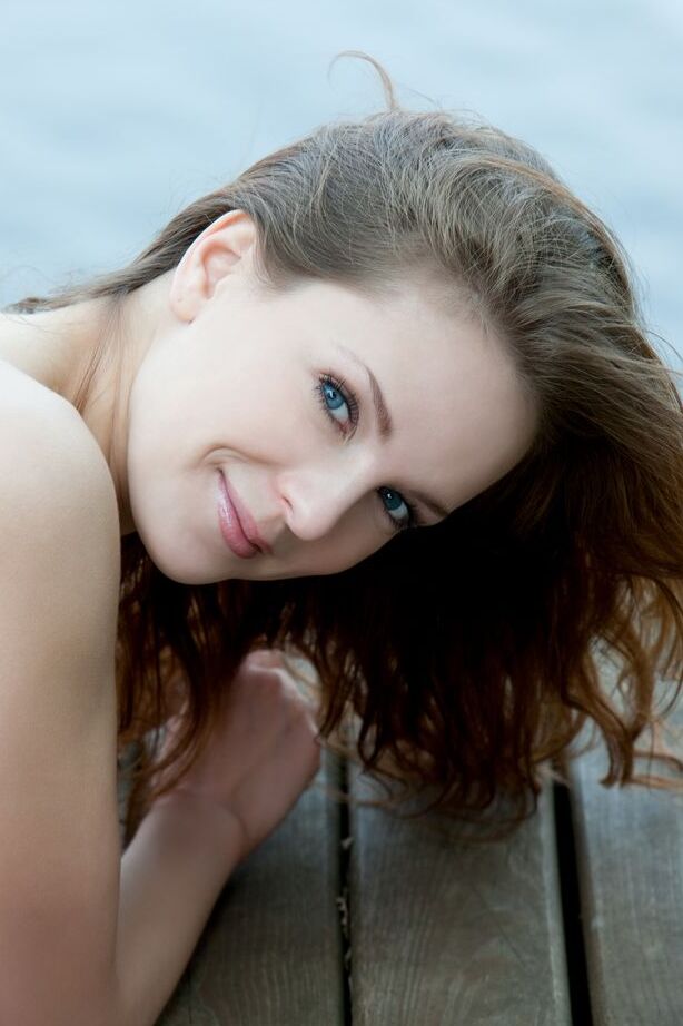 16P Euro model Ilze wears a smile on pretty face during nude posing on dock