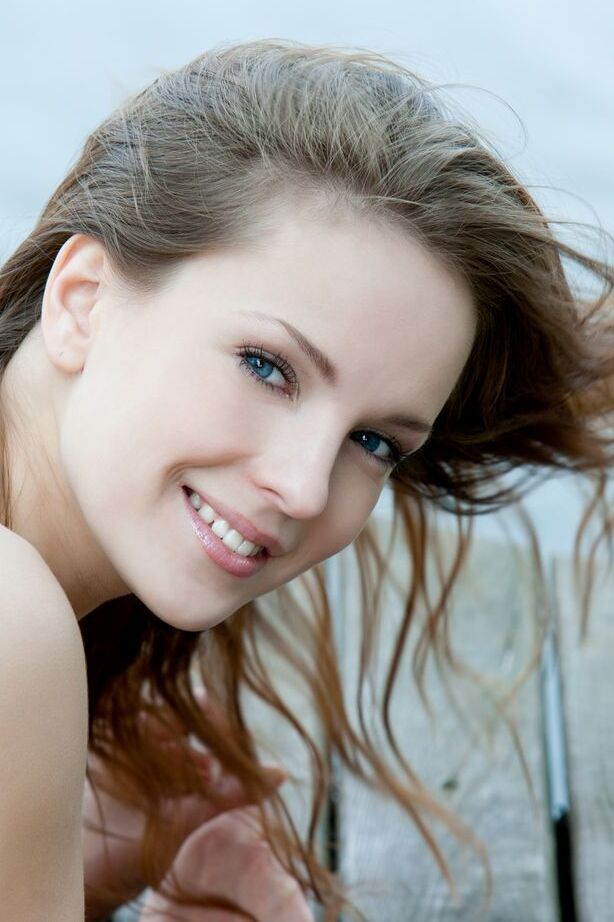 16P Euro model Ilze wears a smile on pretty face during nude posing on dock