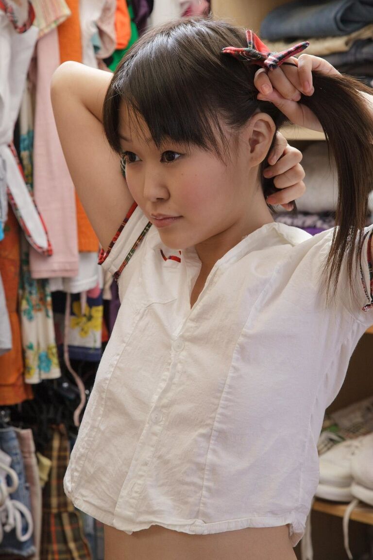 21P Tiny Asian doll puts on school uniform and starts playing with toy afterward