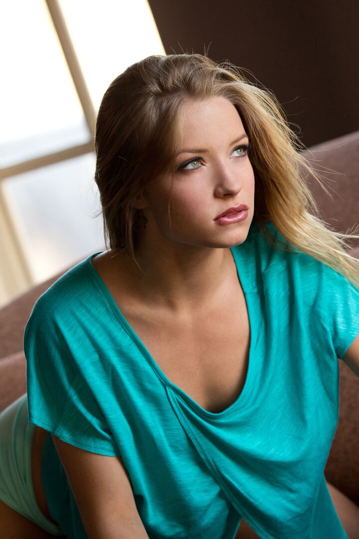 15P Beautiful blonde Alyssa Branch gets completely naked on a fabric sofa