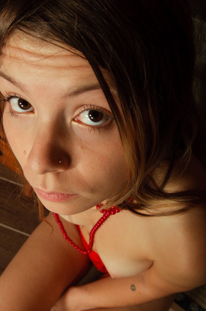 15P Emily 18 wears a red lace thong and spends much of the gallery with her tight