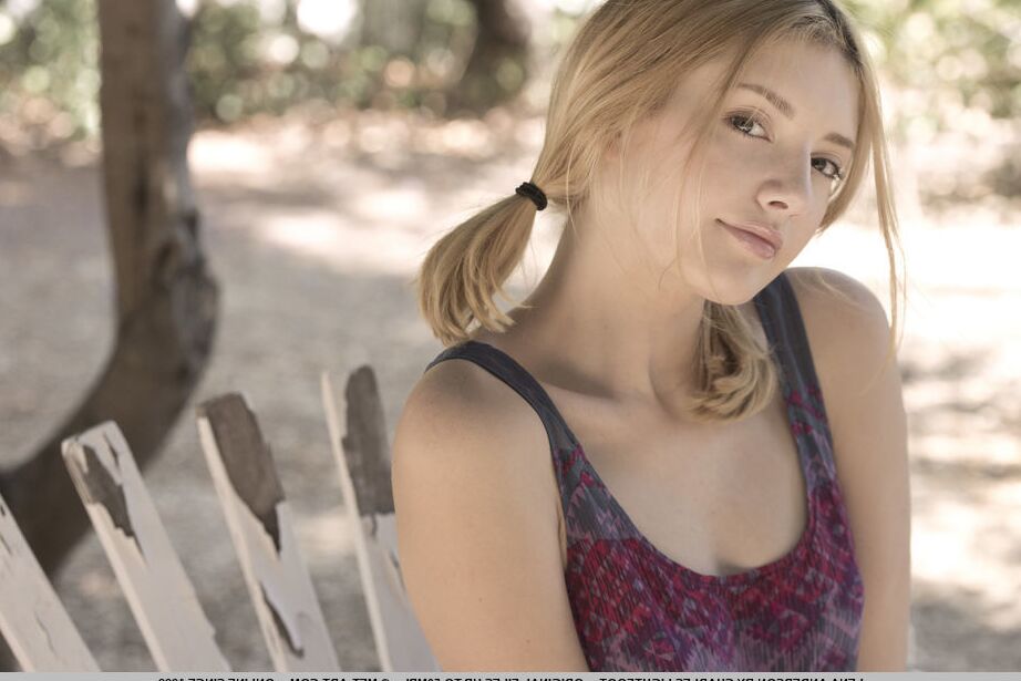18P Teen first timer Lena Anderson vaunts her lithe body under a tree outside