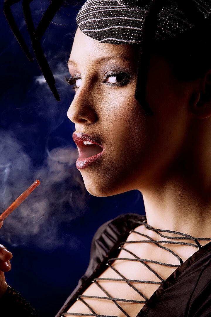15P Beautiful brunette Celeste Star smokes while exposing her vagina in OTK boots