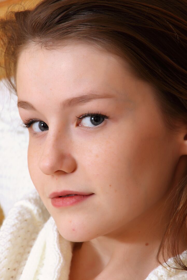 12P Sweet young thing takes off her sweater to spread naked showing tiny twat