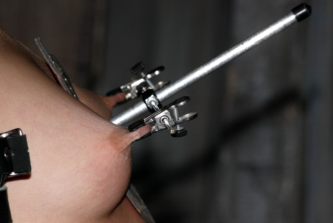 21P Brunette Kylee King gets her perky nipples pinched in hardcore bondage action