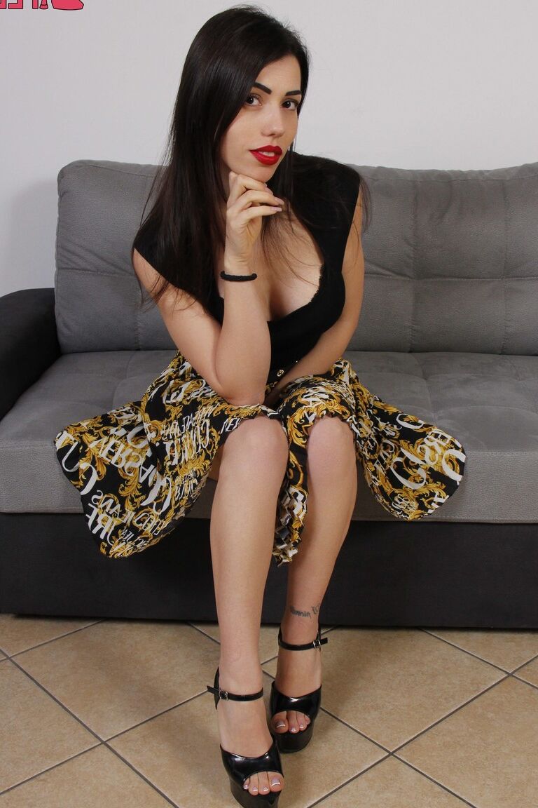 10P Pretty brunette Petra sports red lips while putting her bare feet on display