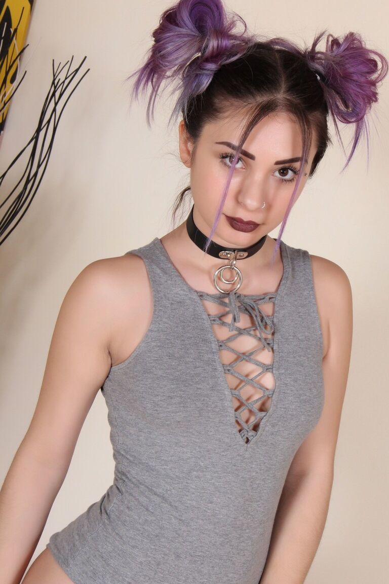 12P Clothed solo girl displays her bare feet and painted toes in pigtails