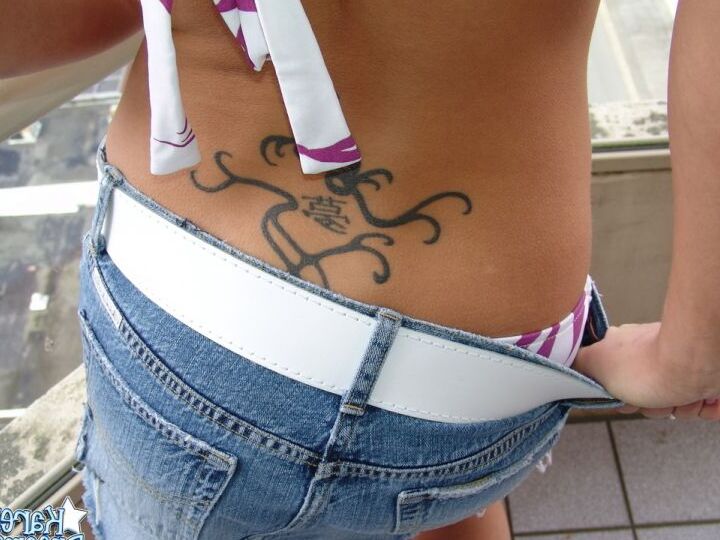 12P Amateur solo girl models in a bikini high up on a condo balcony