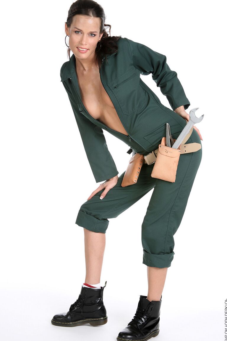 15P Gorgeous brunette Marie removes a jumpsuit to pose nude in a toolbelt and Docs