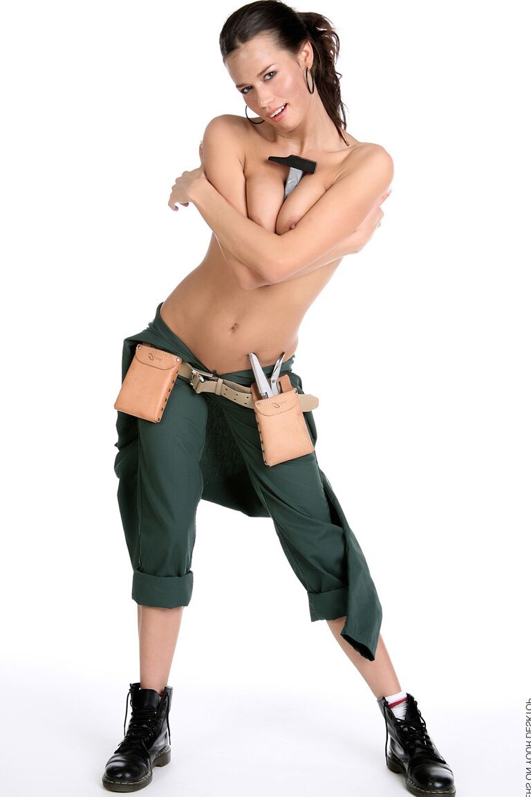 15P Gorgeous brunette Marie removes a jumpsuit to pose nude in a toolbelt and Docs