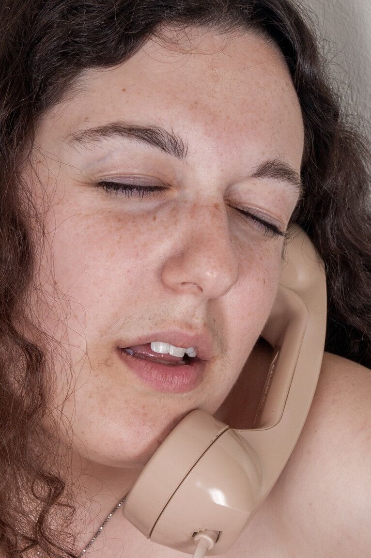 21P Brunette with big tits Tamar strips & rubs her clit while talking on the phone