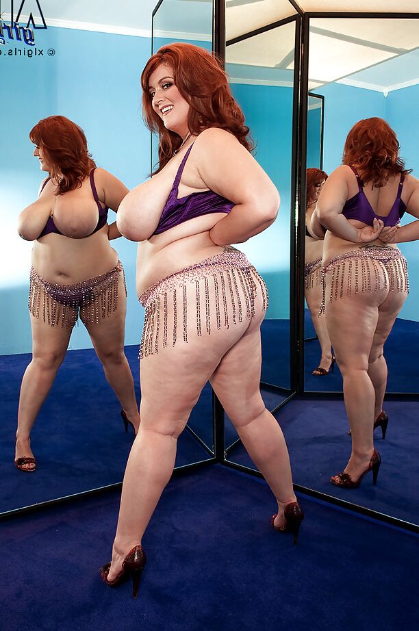 16P Redhead fatty Jade Parker stripping and stuffing her snatch with a huge toy