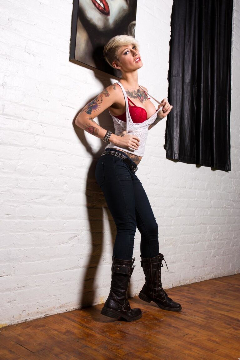 17P Tattooed model Kleio Valentien takes off clothes and boots to model naked