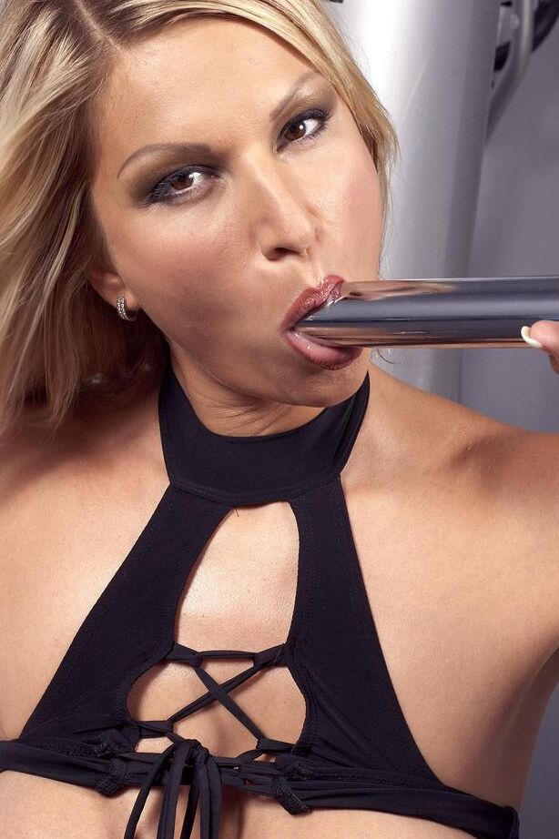 16P Blond chick Carol G toys her own asshole after going a round with punching bag