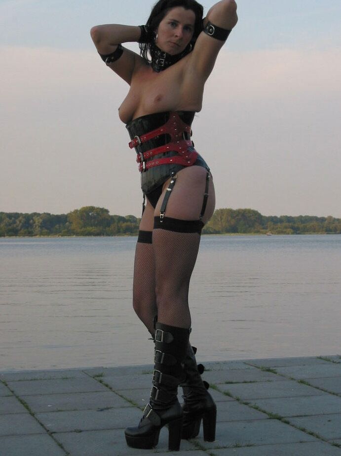 16P Collared slave has her nipples clamped while modelling fetish wear in public