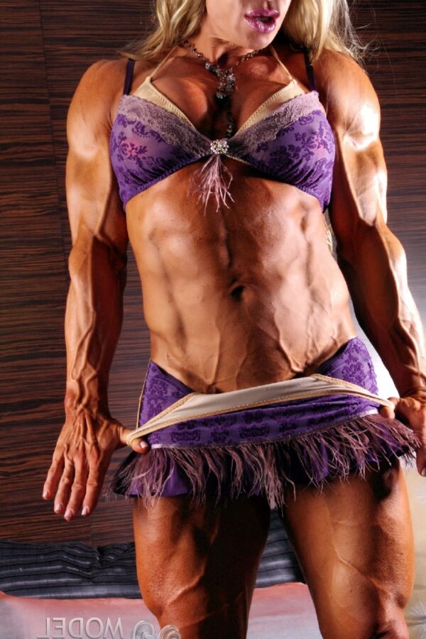 21P Blonde bodybuilder Debi Laszewski shows her huge tanned muscles in a solo