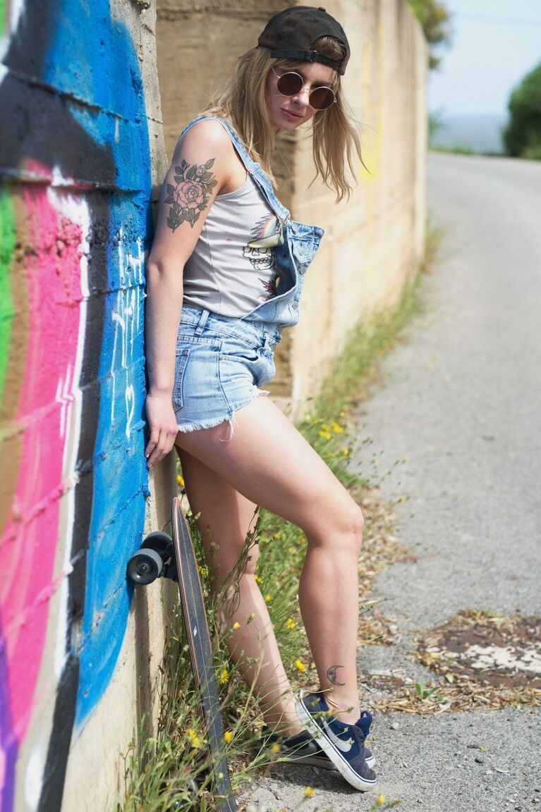 12P Skater girl Pippa Doll skoots down a hill wearing nothing more than a ballcap