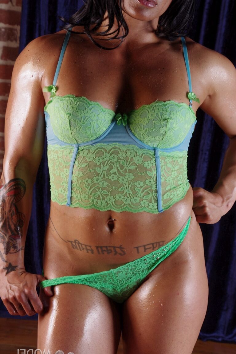21P Bodybuilder Tina Rock shows her muscles while working out in her hot lingerie