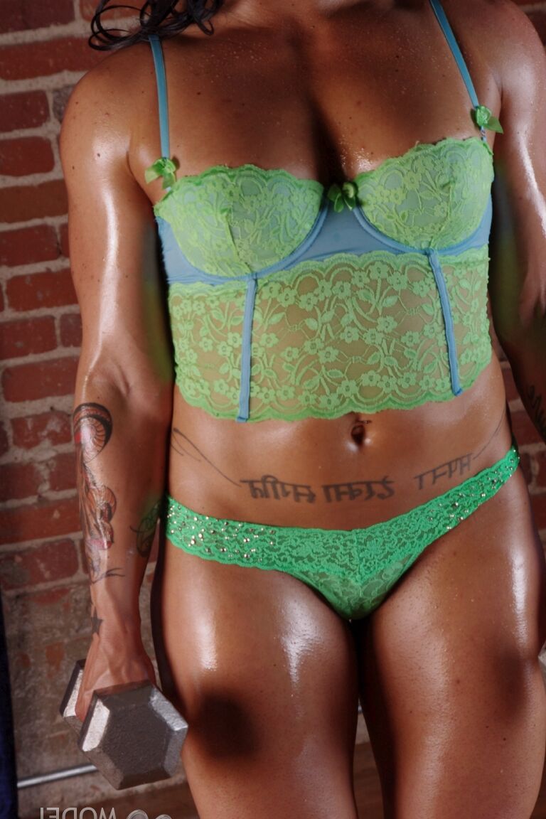 21P Bodybuilder Tina Rock shows her muscles while working out in her hot lingerie