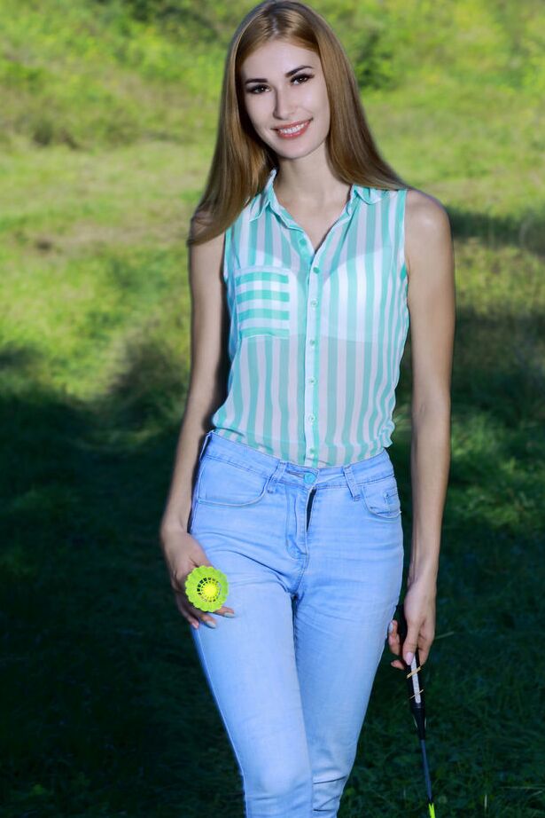 18P Thin redhead Aileen gets totally naked in a field after playing badminton