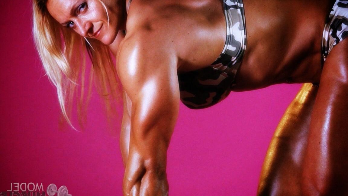 21P Sexy bodybuilder Brigita Brezovac displays her huge muscles while working out