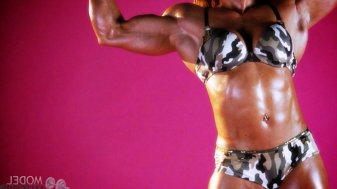 21P Sexy bodybuilder Brigita Brezovac displays her huge muscles while working out