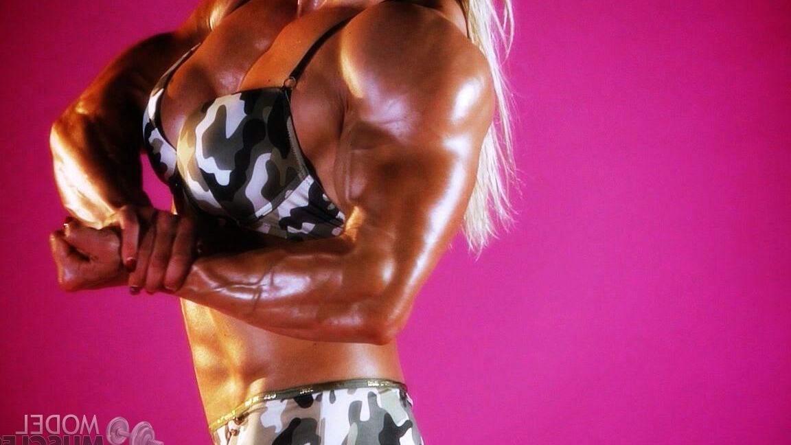 21P Sexy bodybuilder Brigita Brezovac displays her huge muscles while working out