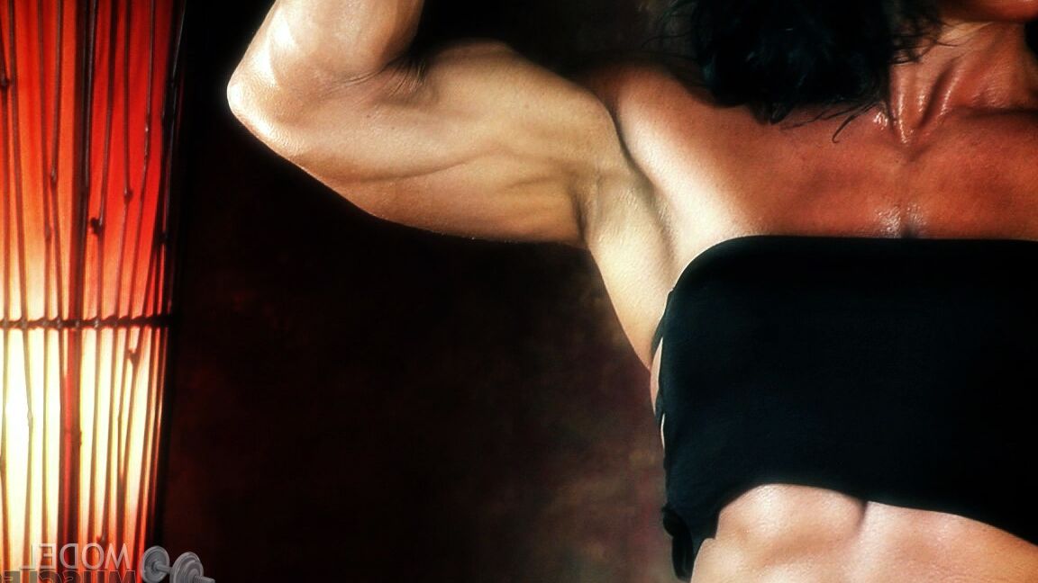21P Brunette bodybuilder Debbie Bramwell flexing her strong body & her tight ass