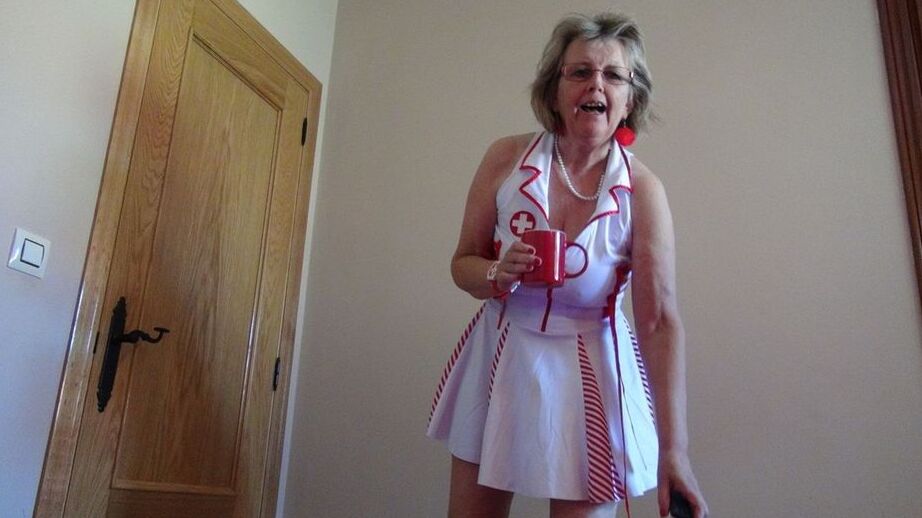 20P Old lady Abby Roberts frees sagging tits from nurse outfit before dildo riding