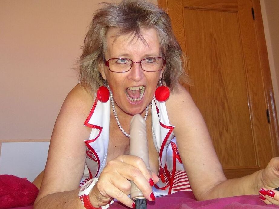 20P Old lady Abby Roberts frees sagging tits from nurse outfit before dildo riding