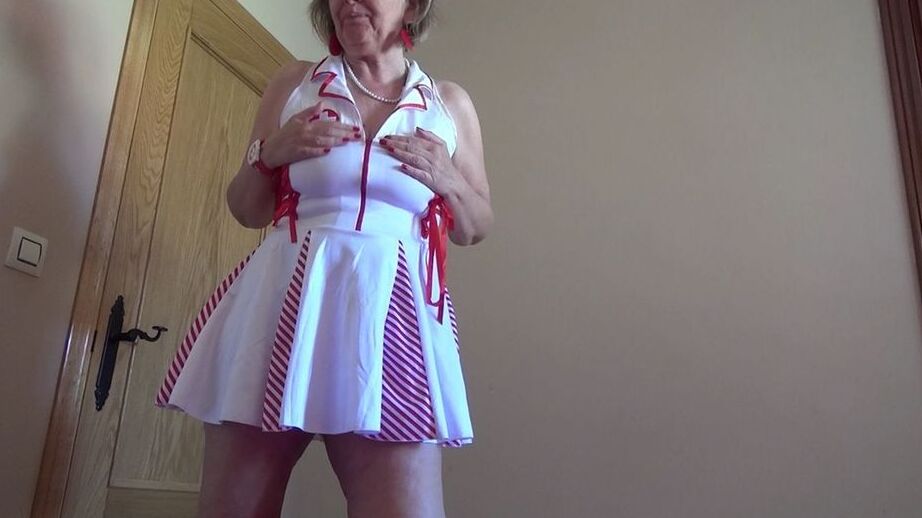 20P Old lady Abby Roberts frees sagging tits from nurse outfit before dildo riding