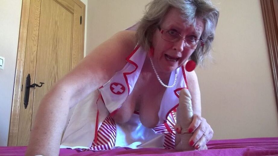 20P Old lady Abby Roberts frees sagging tits from nurse outfit before dildo riding