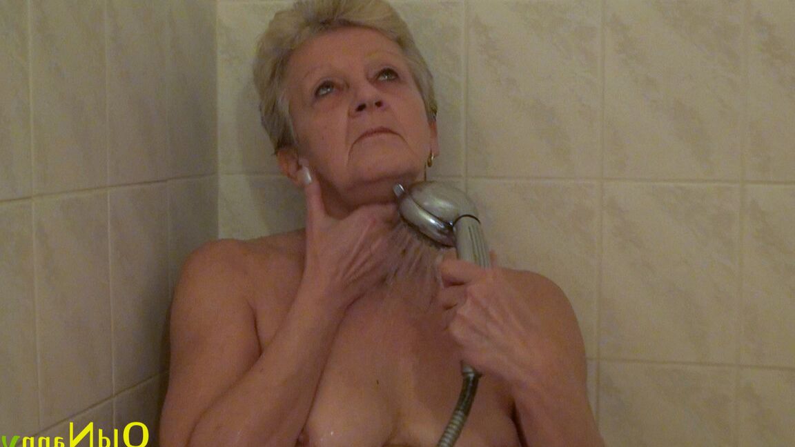 18P Sexy gray haired grandma Emmy rubs her tasty shaved clam while showering