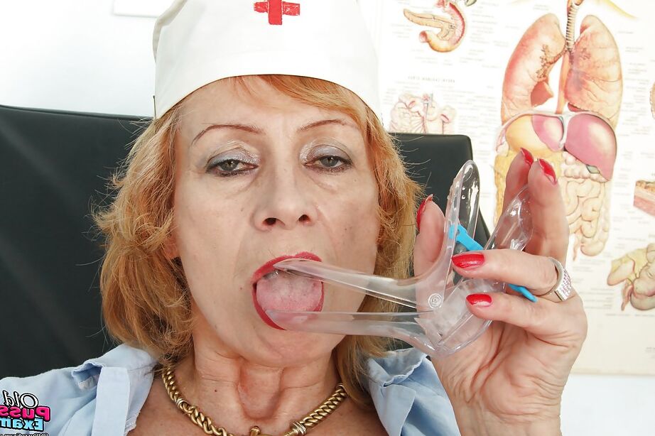 16P Naughty granny in black stockings playing with a huge jelly toy