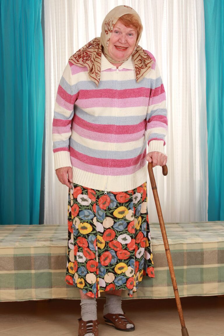 15P Fat old granny Alice with cane posing fully clothed in long skirt and socks