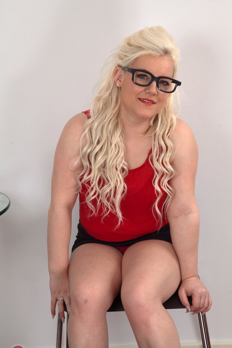 21P Nerdy blonde Lorissa exposes her big tits and hairy twat in a solo