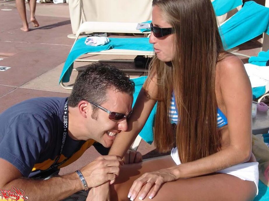 15P Fully clothed female Lori Anderson has her hairy arms licked near a pool