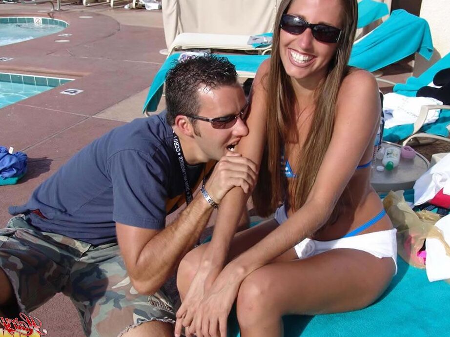 15P Fully clothed female Lori Anderson has her hairy arms licked near a pool