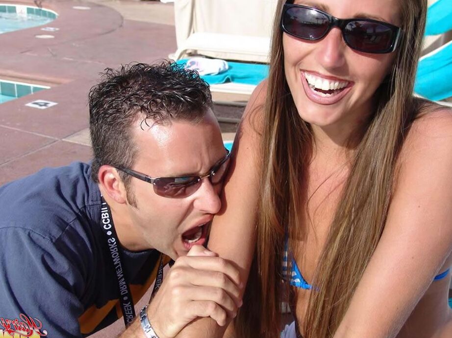 15P Fully clothed female Lori Anderson has her hairy arms licked near a pool