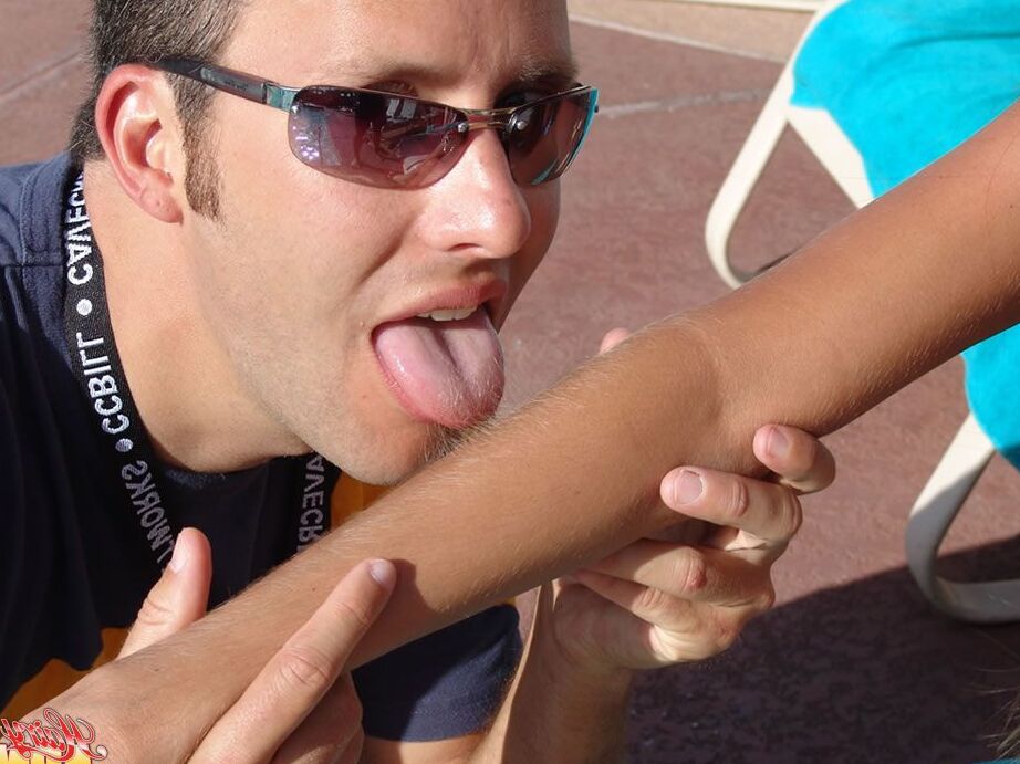 15P Fully clothed female Lori Anderson has her hairy arms licked near a pool