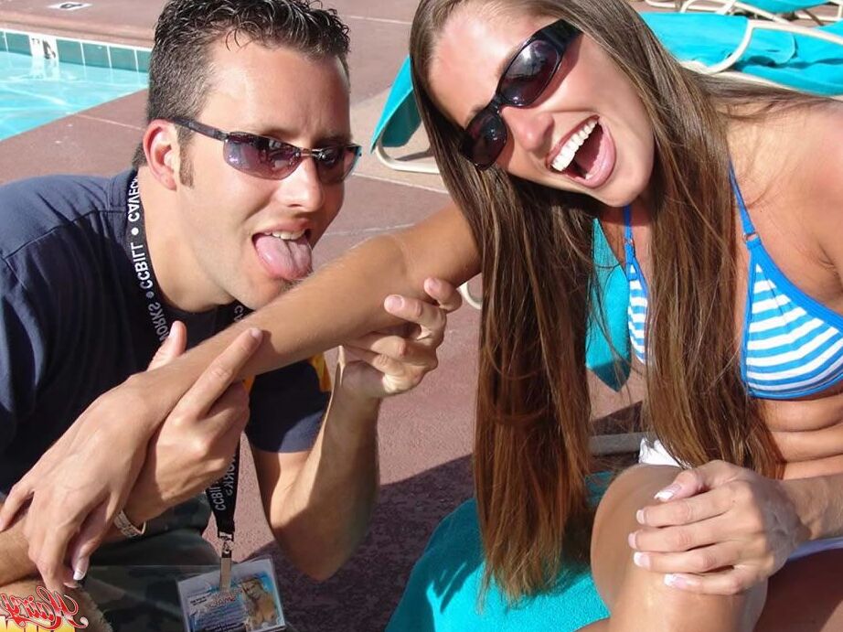 15P Fully clothed female Lori Anderson has her hairy arms licked near a pool