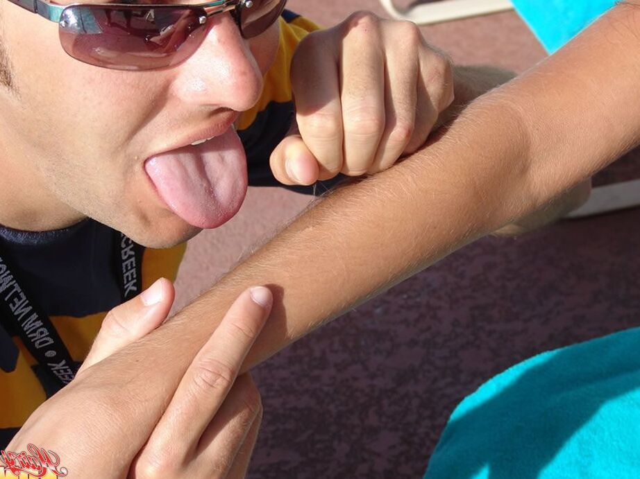 15P Fully clothed female Lori Anderson has her hairy arms licked near a pool
