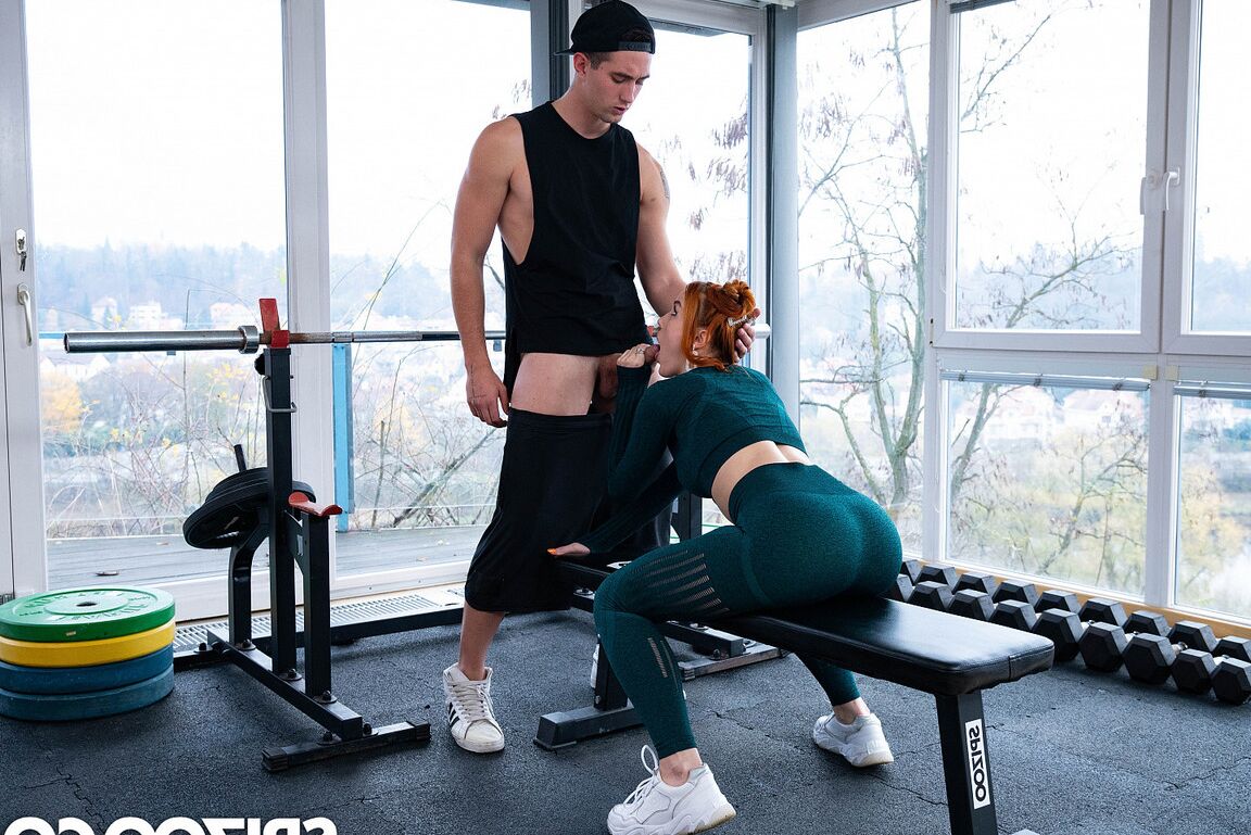 21P Ginger babe Charlie Red unveils her big tits before getting banged at the gym