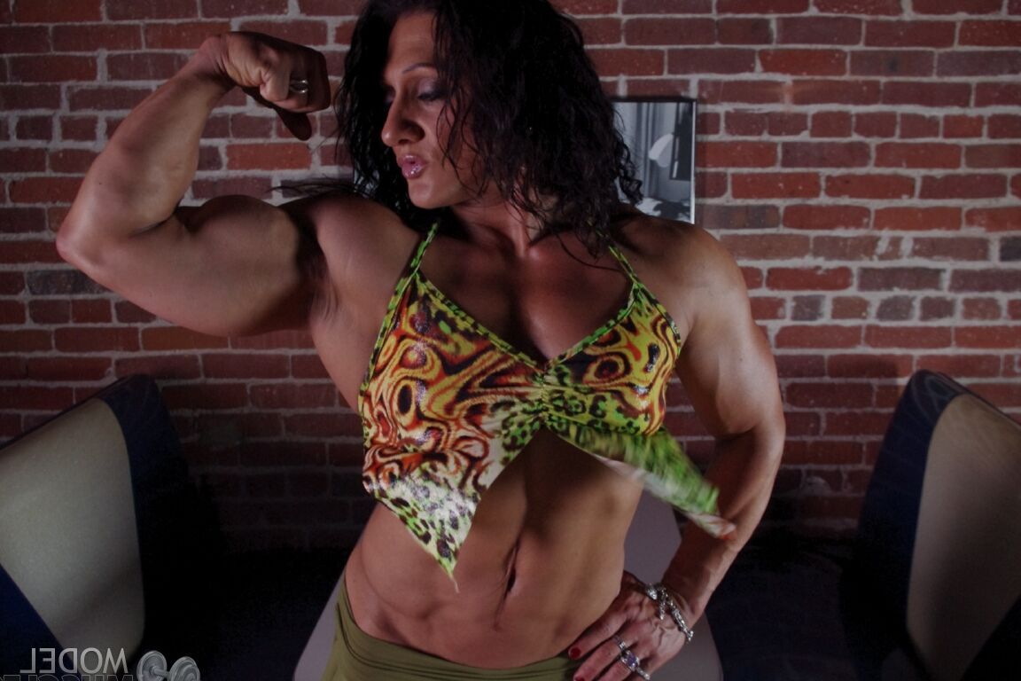 21P Sizzling hot bodybuilder Tonia Moore flaunts her muscles & sexy ass in a thong