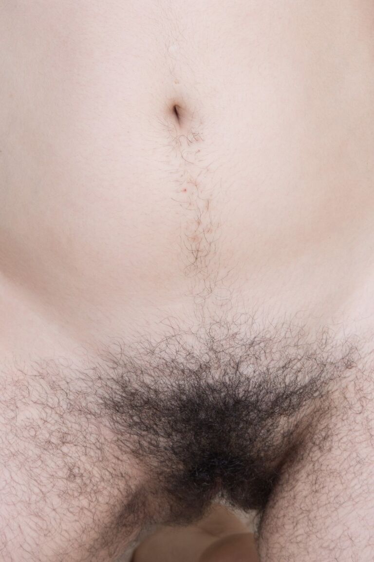 21P Hairy babe Wara reveals her unshaved armpits and furry crotch on the bed