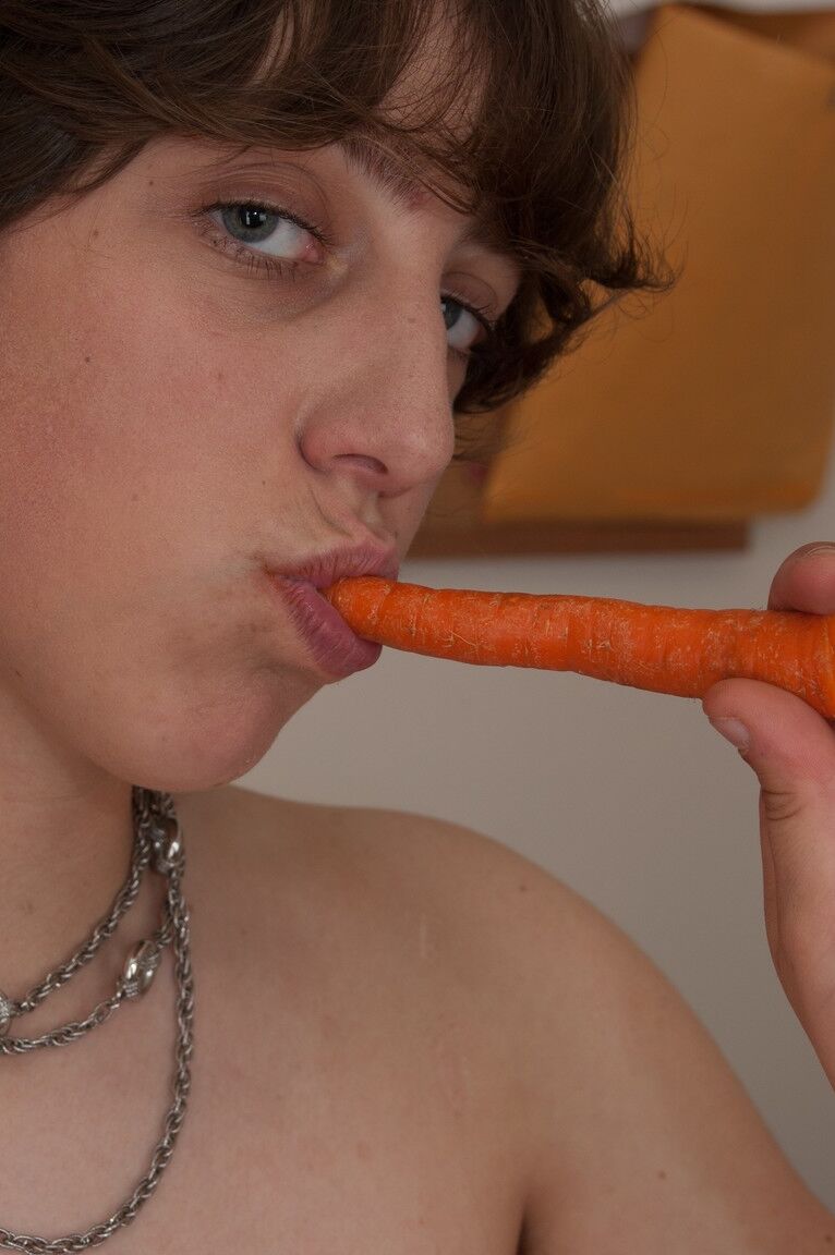 17P Girl with big natural boobs Cassie strips and sticks carrot in her hairy twat
