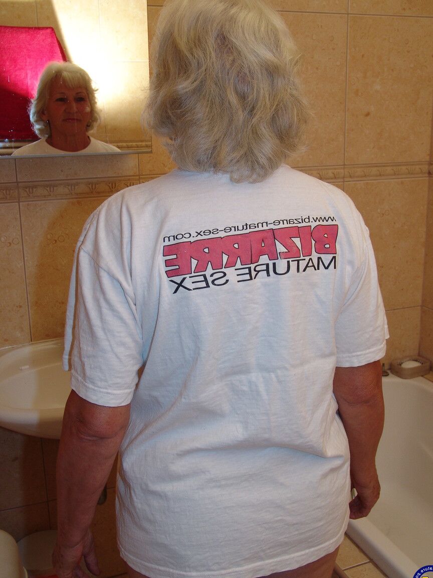 21P Slutty granny Maria pisses on a bucket before toying her warm twat with a bat