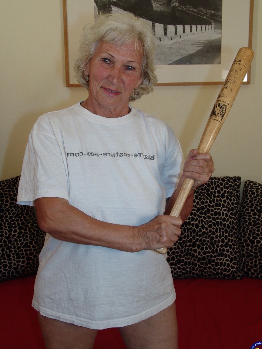 21P Slutty granny Maria pisses on a bucket before toying her warm twat with a bat