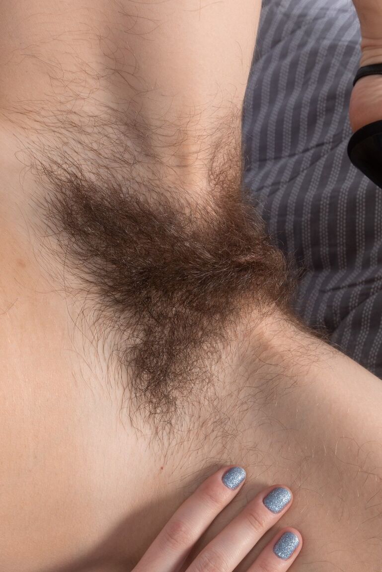 16P Amateur model Atisha stretches out her full bush after showing hairy underarms